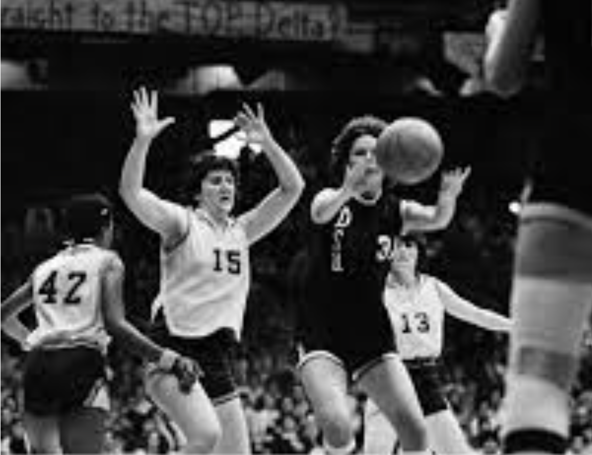Louisiana State and Delta State Women's Basketball Teams in mid-play during the 1977 AIAW National Basketball Championship. 