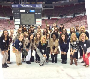 PRSSA members, along with adviser Julie Hagenbuch (front row at far right) pose on the ice at Joe Louis Arena.